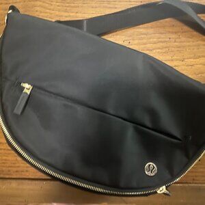 Lululemon black with gold trim All Night Festival Bag Micro 2L